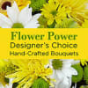 Bright assortment of mixed seasonal flowers in yellow tones arranged in a