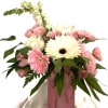 Lovely pinks and cream flowers and greens in a premium glass vase.