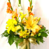 Send some sunny vibes to someone special. This tall and colorful arrangement