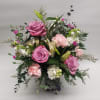 While this wonderful mix of lavender roses, stock, carnations, lilies, limonium and