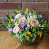 Gorgeous peach roses, ranunculus, fresh fragrant freesia, yellow solidago and italian ruscus