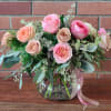 Mixed garden cabbage roses also known as organic heirloom roses in muted