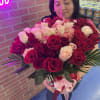 50 ROSES OF DIFFERENT COLORS IN A GLASS