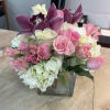 Our best seller in a size down. White hydrangea with colored roses