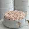 Light peach preserved roses in our flat vase , beautiful gift and