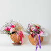 This delightful flower arrangement in a basket is an elegant and thoughtful