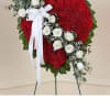 Honor a loved one with a special tribute. Our heart-shaped standing arrangement