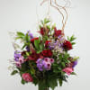 This stunning floral arrangement captures the charm of a blooming garden with