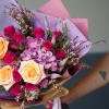 The Radiant Bloom Bouquet is a vibrant and elegant arrangement that combines