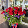 Medium sized very classy red and purple arrangement with 18 premium red