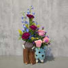 Adorable ceramic flower vase featuring a classic grandma and grandpa dressed in