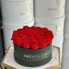 Timeless red preserved roses delicately arranged in a  black paper box&mdash;a