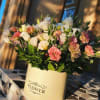 An airy arrangement of delicate lisianthus in a box - like a