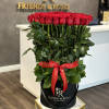 A magnificent standing bouquet of red roses is an unforgettable gift for
