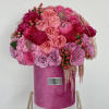 Introducing a luxurious velvet box overflowing with an opulent assortment of flowers