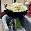 This delicate and elegant bouquet of white roses in various varieties is