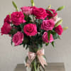 Delightful  bouquet of  eighteen long stem fuchsia and pink roses