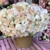 This gorgeous box with white roses, hydrangeas, spray roses , lisianthus white