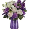 With its dramatic geometric glass vase and bountiful purple blooms, this Mother&#039;s