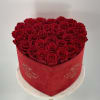 Preserved red roses in a red velvet Heart Shaped Box .Lasts one