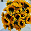This is a floral arrangement with premium sunflowers and other fillers .