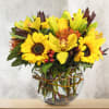 This unique design includes sunflowers, yellow lilies, cymbidium orchids, pin cushion protea