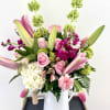 A large arrangement created with all of mom&#039;s favorite flowers. Perfect to