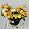 Inside a chic vase, the vibrant hues of summer come alive. Yellow
