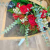 A beautiful hand wrapped arrangement of premium long stem red roses.

-STANDARD: 12