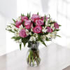 Lavender Blooms is a graceful and soothing floral arrangement that captures the
