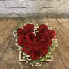 A unique presentation of red roses. 
A wooden box holds one dozen