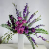 Elegant purple and pink arrangement to celebrate a classy friend&#039;s  life.