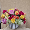 This cylindrical vase of flowers is kind of like a time capsule