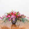 A beautiful garden of flowers with proteas, mini calla lilies, spray roses
