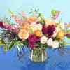 
 Crafted with an artist&#039;s touch, this arrangement combines the allure of