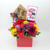 A small arrangement made with roses, gerberas, and greenery with Mother&#039;s day