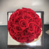 From a local provider, this gorgeous piece features 25 real preserved roses