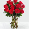 This all-red flower arrangement is hand-arranged with 12 long stem pink roses