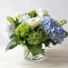 Sky Garden is a refreshing arrangement of neutral premium roses, lush greens