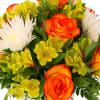 hot pink roses combine with white lilies in this elegant silver vase