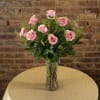 One Dozen Pink Roses , Arranged Beautifully in a Glass Vase.