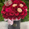 Red and pink roses delicately arranged and finished up with a lovely