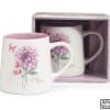 Arrangement designed in an 16oz Ceramic mug with a lavender and pink