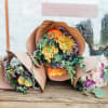 Mix of seasonal florals. Standard includes about 6-8 stems accentuated with foliage