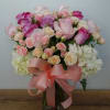 This gorgeous bouquet includes white hydrangea, light pink roses, pink roses, cr&Atilde;&uml;me