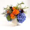 A bright and colorful low-compact arrangement for any special events, parties, birthdays