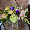 Assortment of classy, high end, spring blooms designed in a modern upscale