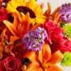 Like a warm embrace, our vibrant flower bouquet delivers your sentiments to