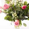 A beautiful Dozen Roses in lavender on a base of Eucalyptus and