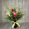 Assorted spring blooms in pinks and greens.